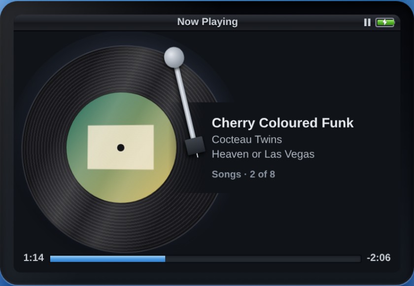The same vinyl view on the dark screen, the record lit by a soft halo.